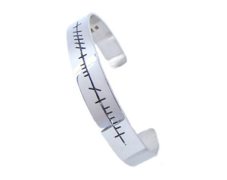 Silver mens ogham cuff. Trying to buy a gift for a husband, boyfriend, brother, son or friend? Get him something original that was created and made in Ireland by skilled Irish craftsmen and designers.